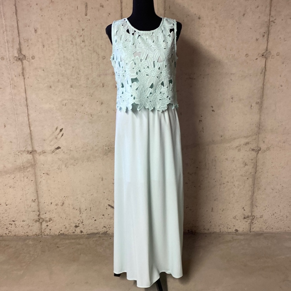 Mint green maxi dress partially lined with side slits.